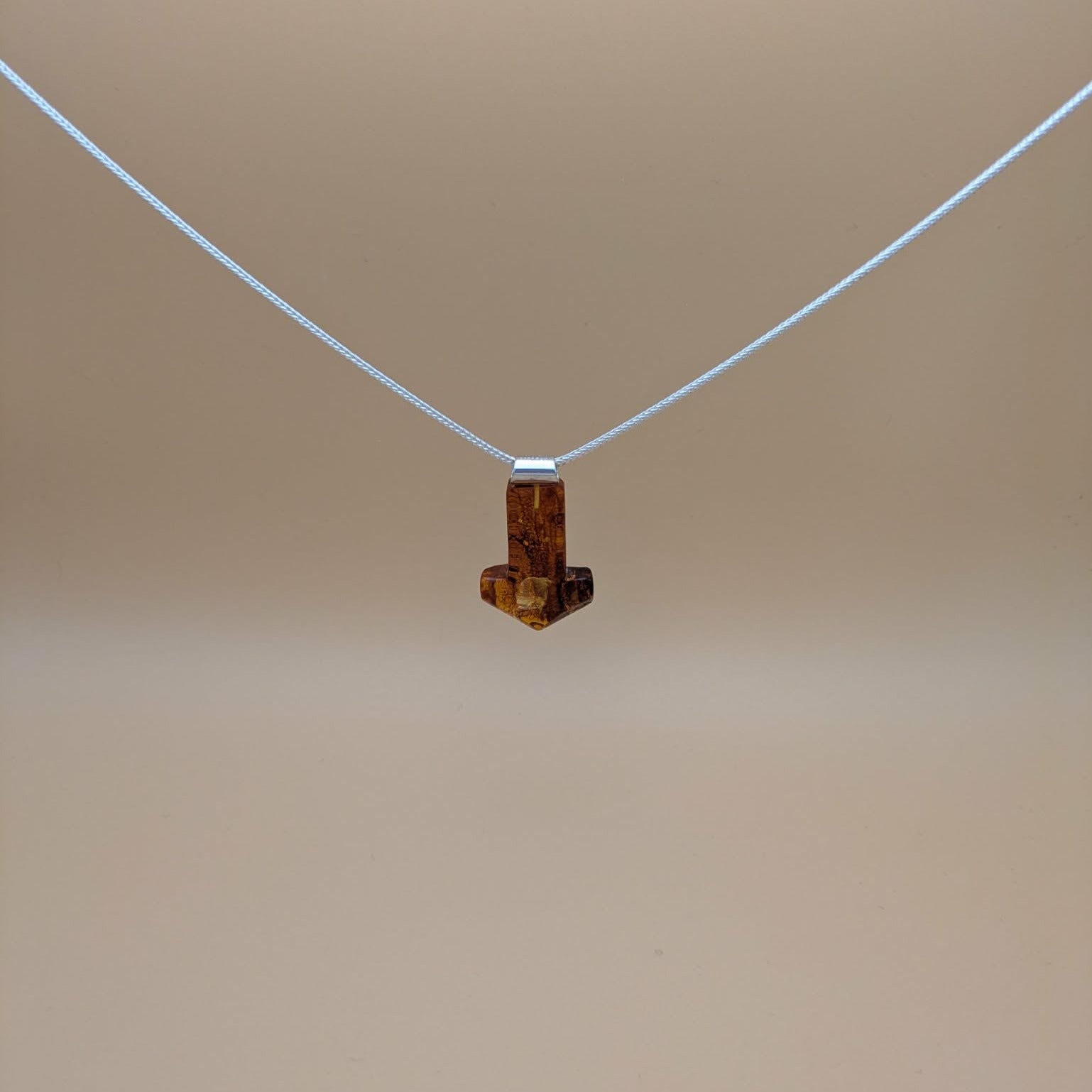 Handcarved Mjølner amber pendant with silver tube