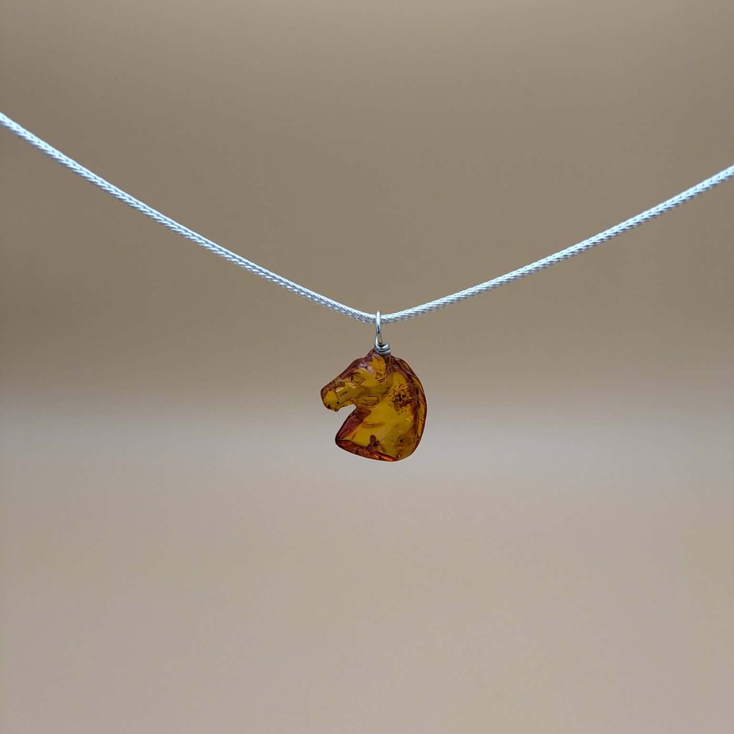 Amber horse pendant