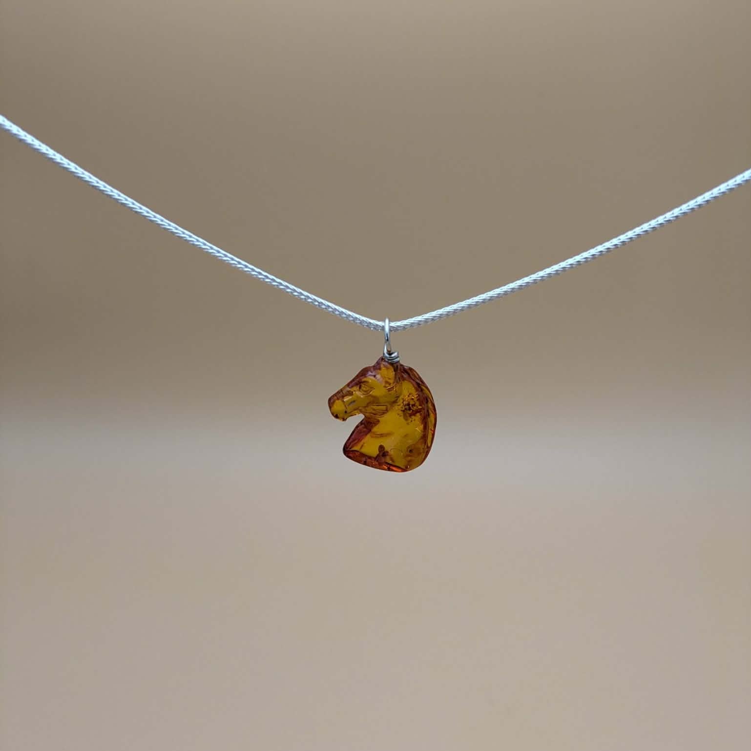 Amber horse pendant
