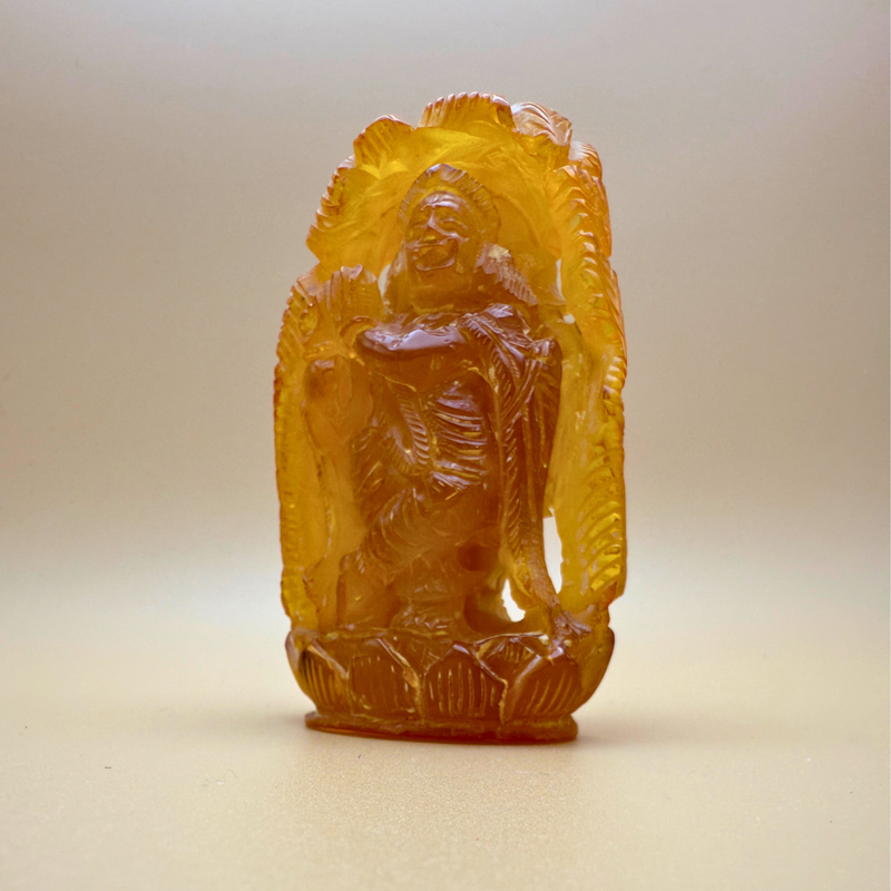 Krishna - Amber Figure with Peacock