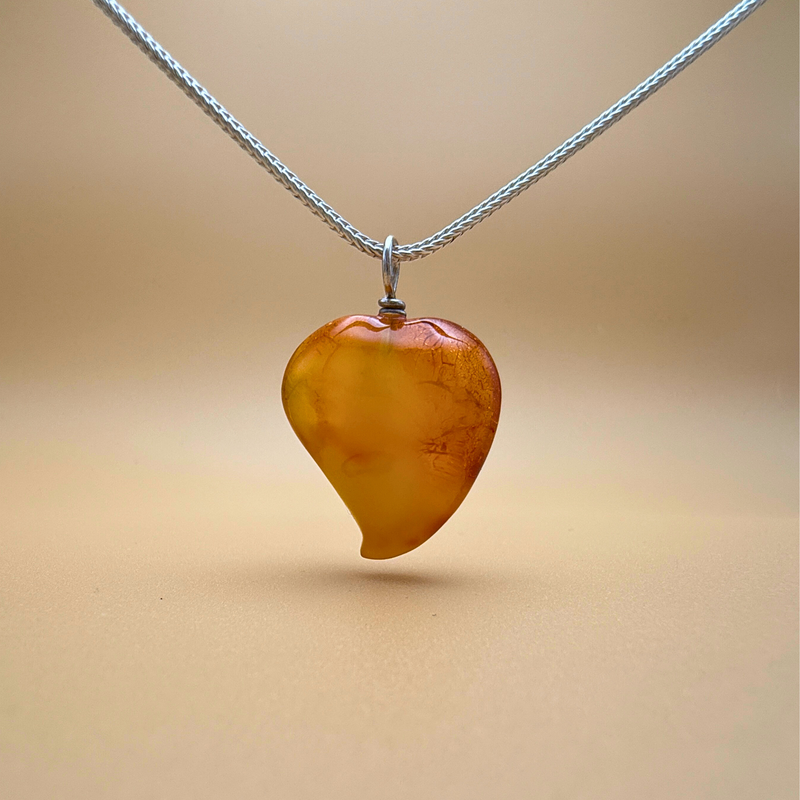 Amber heart pendant from Ravgaard, with milky cloud