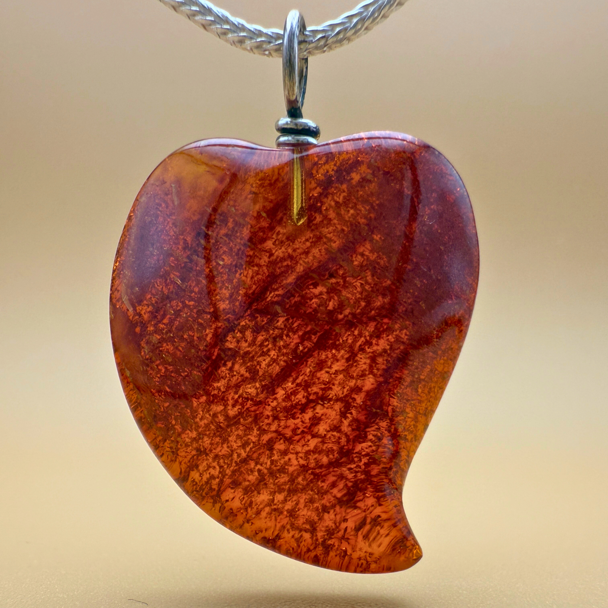 Amber heart pendant in wine red with silver bail Ravgaard design