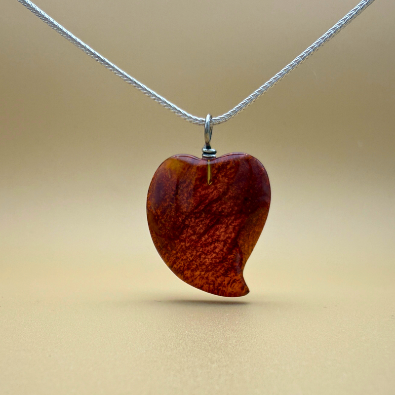 Dancing Heart Amber Pendant – Deep red shimmer